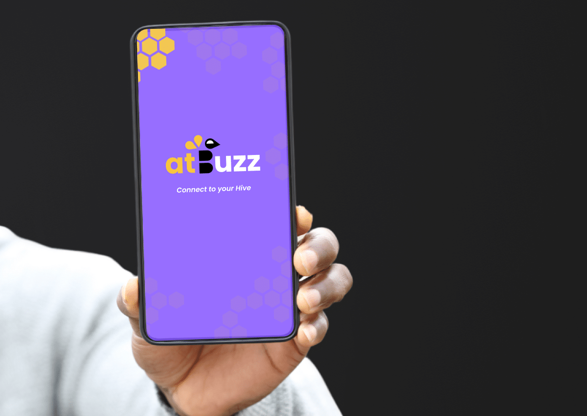 Hand holding phone with atBuzz screen